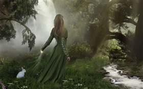 Vert fille robe de fantaisie dans la forêt, lapin blanc